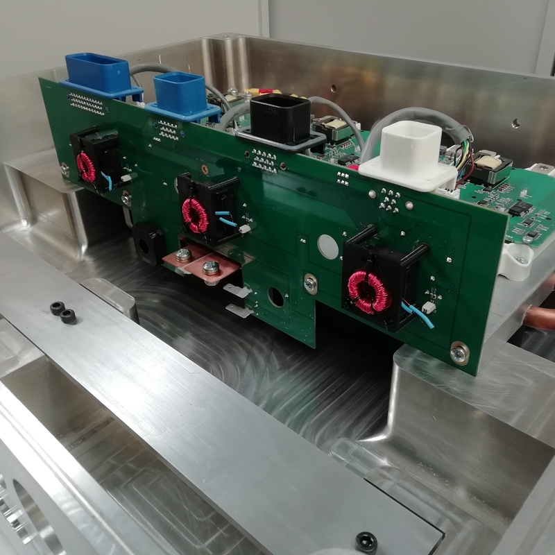 High power multi circuit board system including design and manufacture of a CNC machined enclosure. Featured water-cooled custom heatsink.